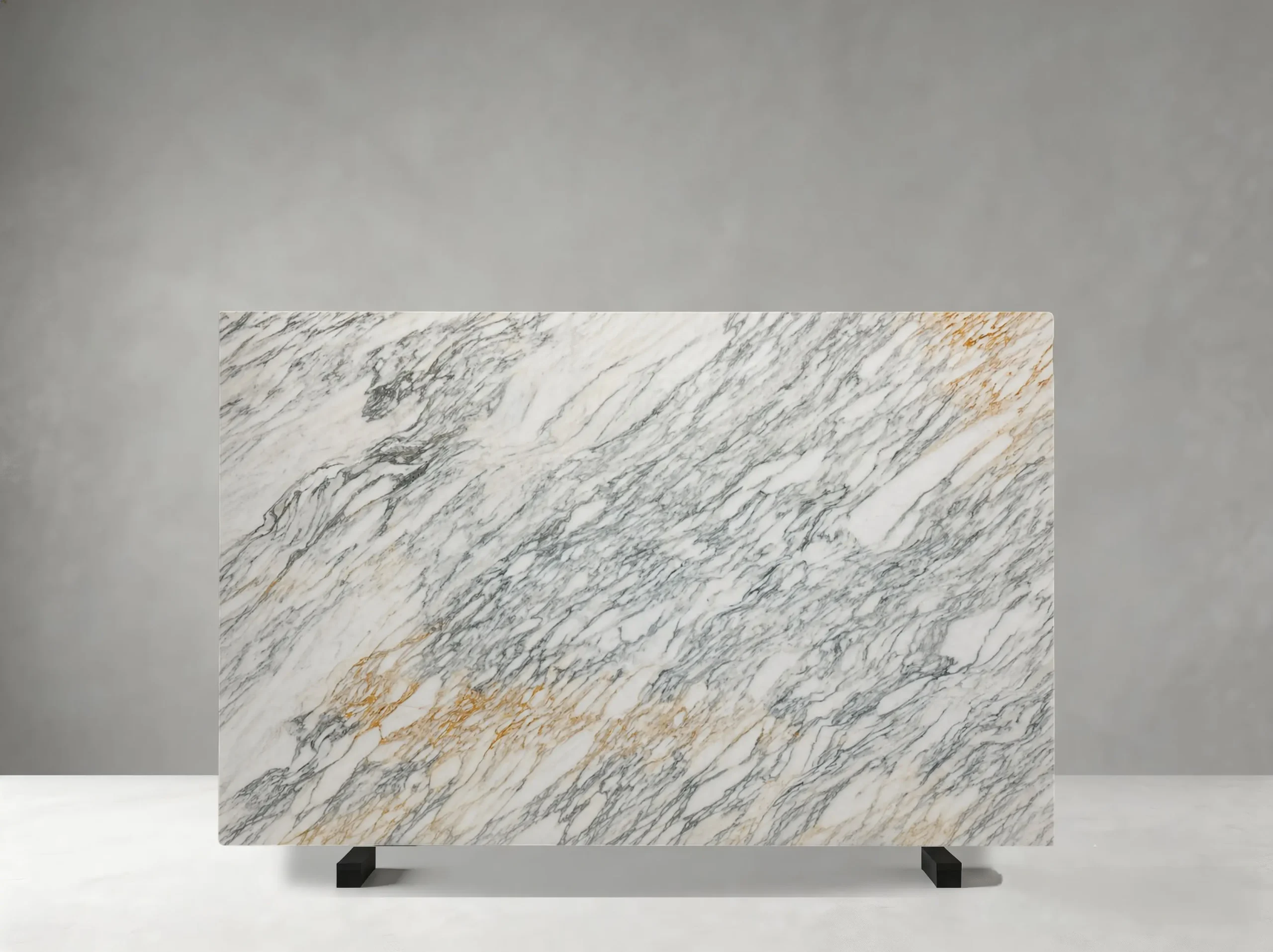 lasa-bianco-nuvolato-marble-grey-gold-vein-slab.webp Lasa Bianco Nuvolato Marble slab with dense grey veins and warm gold accents