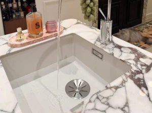 Custom Marmi Breccia Violetta marble integrated sink and countertop
