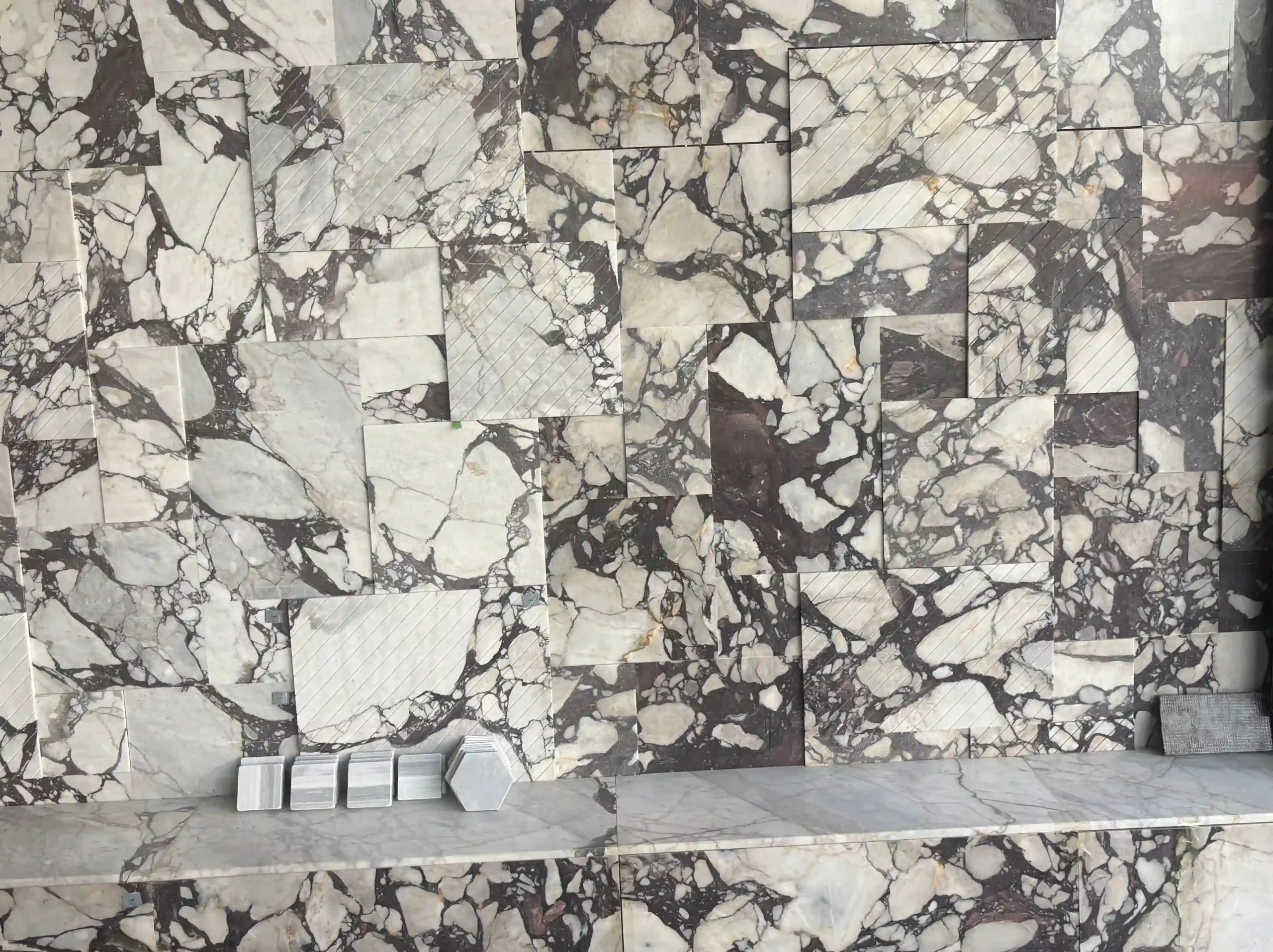 marmi-breccia-violetta-marble-slab-selection.webp Marmi Breccia Violetta marble slabs with ivory-white, violet, burgundy and grey brecciated veining