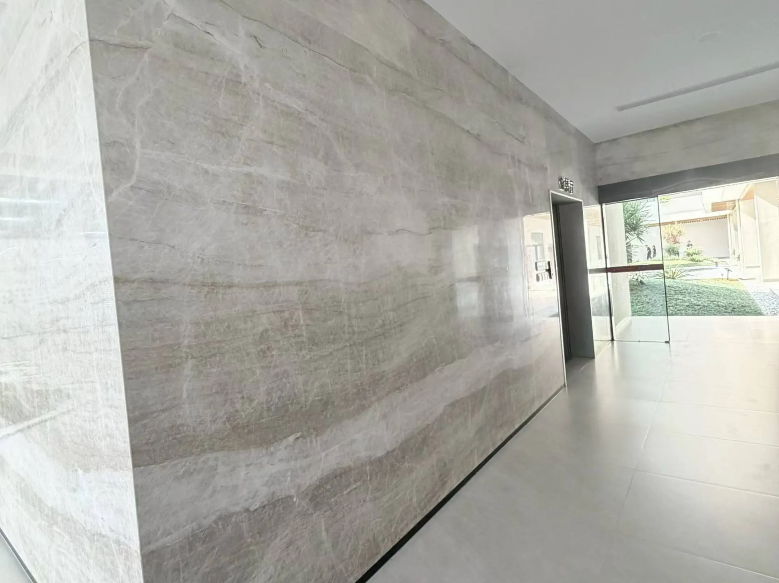 matira-quartzite-kitchen-island-countertop.webp Polished Wooden Black Marble panels with linear grain