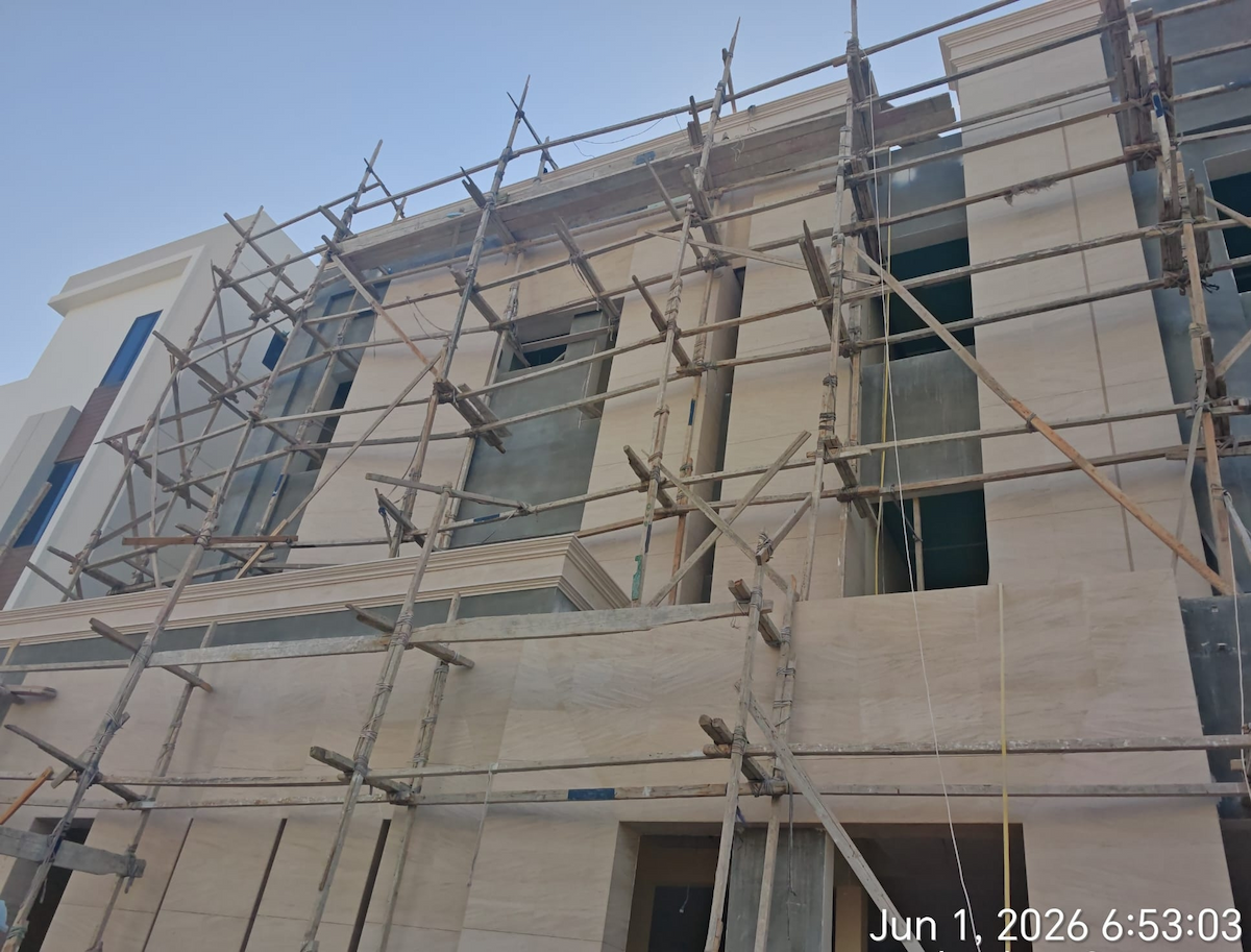 Moca Cream Limestone cornice installed on exterior villa facade by Show Stone