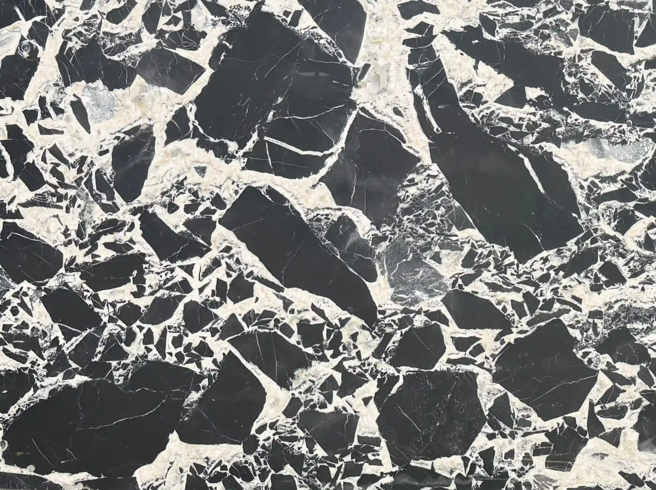 napoleon-black-marble-close-up-black-white-breccia-03.webp napoleon black marble close up black and white breccia pattern for custom interiors