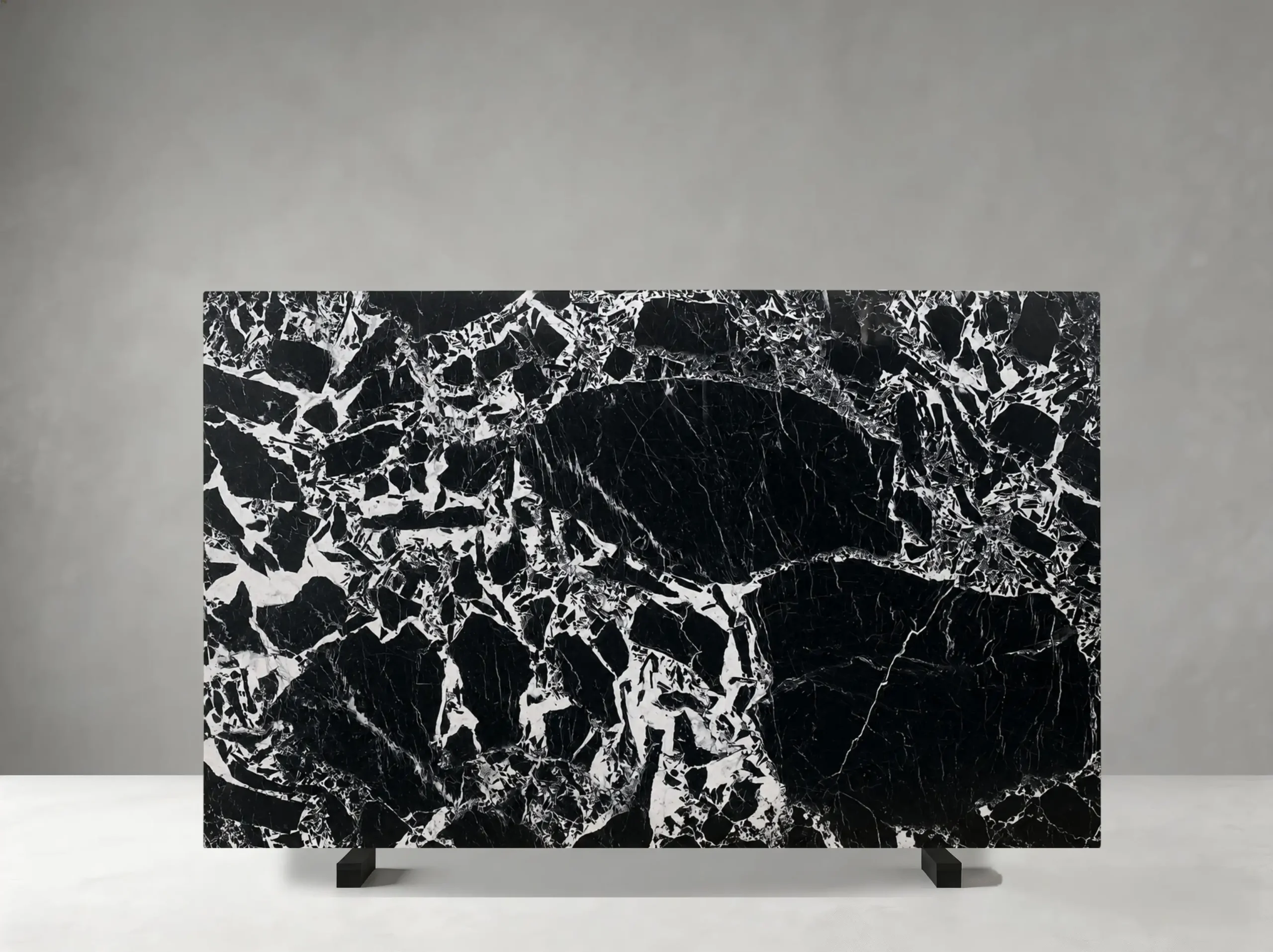napoleon-black-marble-slab-bold-white-veining-04.webp napoleon black marble slab with deep black base and bold white veining for walls and counters