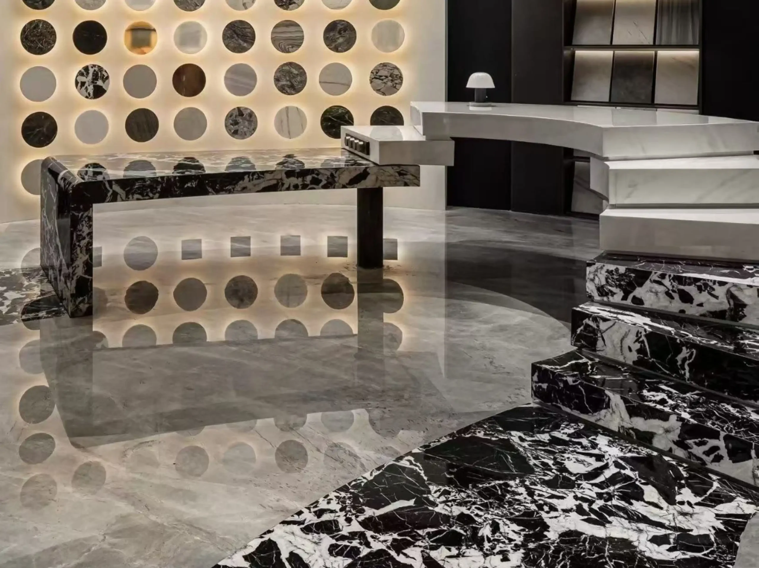 nepoleon-black-marble-showroom-floor-stairs-02.webp nepoleon black marble showroom floor and staircase with bold black white breccia pattern