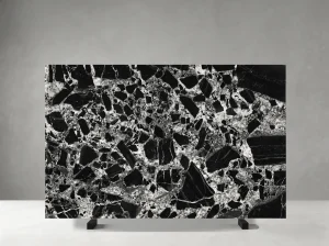 nepoleon black marble slab deep black background with bold white breccia pattern