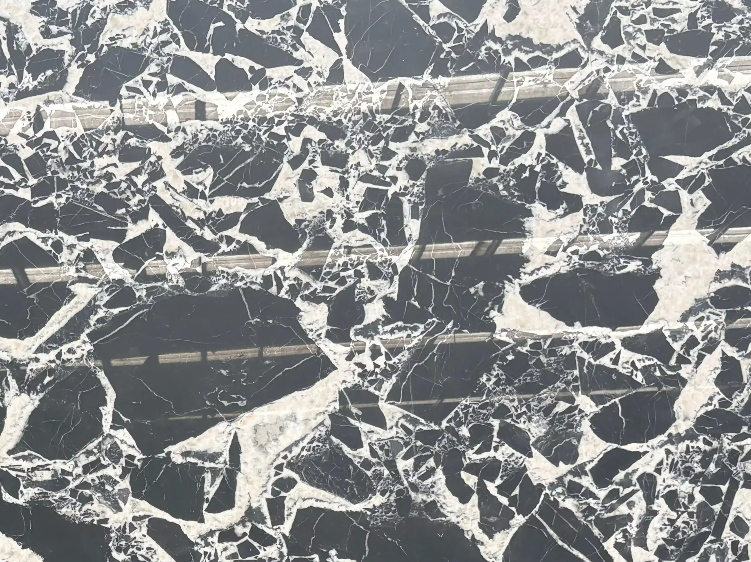 noir-grand-antique-marble-black-white-breccia-texture-03.webp noir grand antique marble close up black white breccia texture for custom stone projects