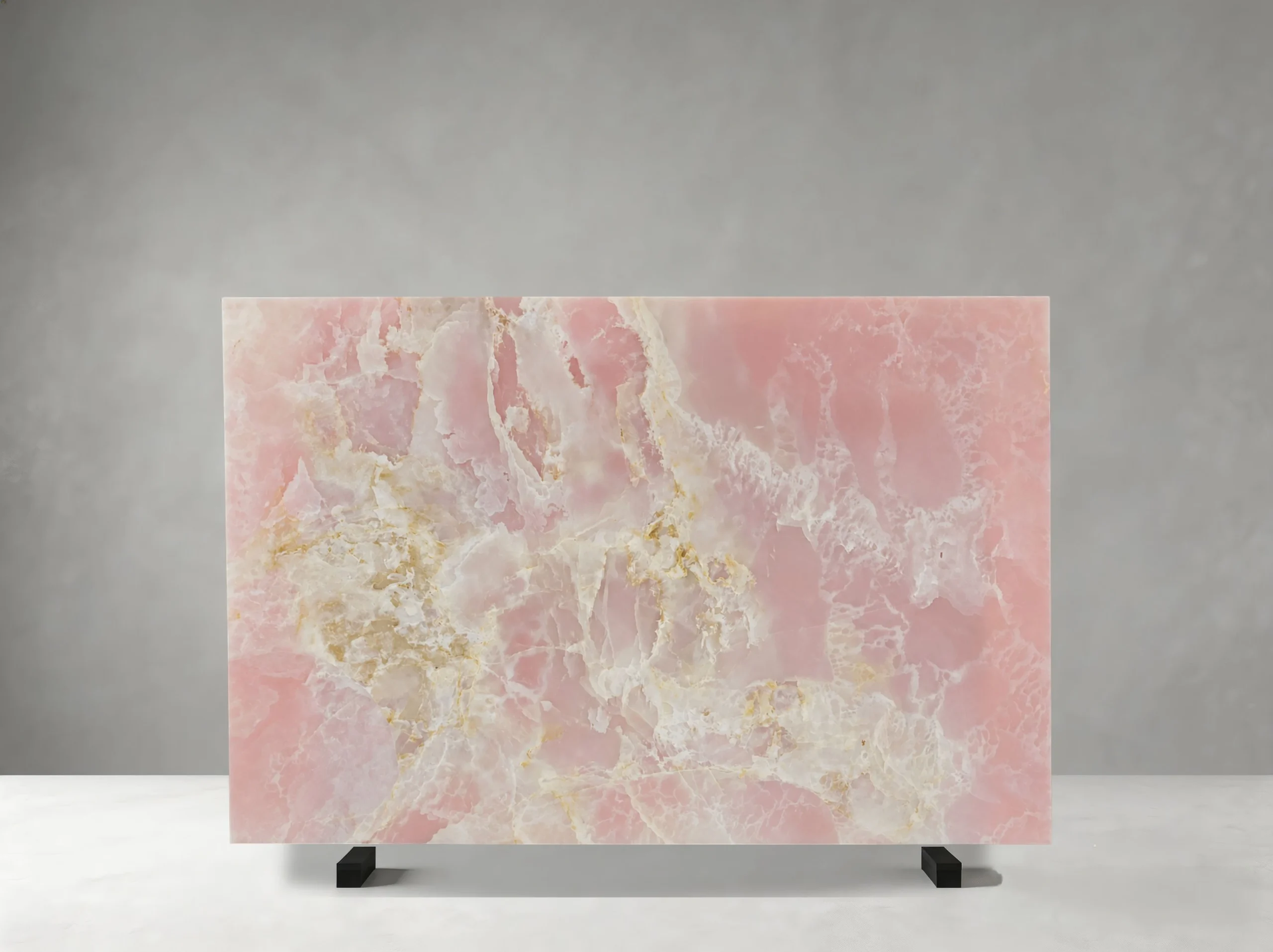 onice-rosso-slab-ivory-honey-pattern-front-view-05.webp Polished Onice Rosso slab with pink tones, ivory crystalline clouding, and warm honey mineral accents