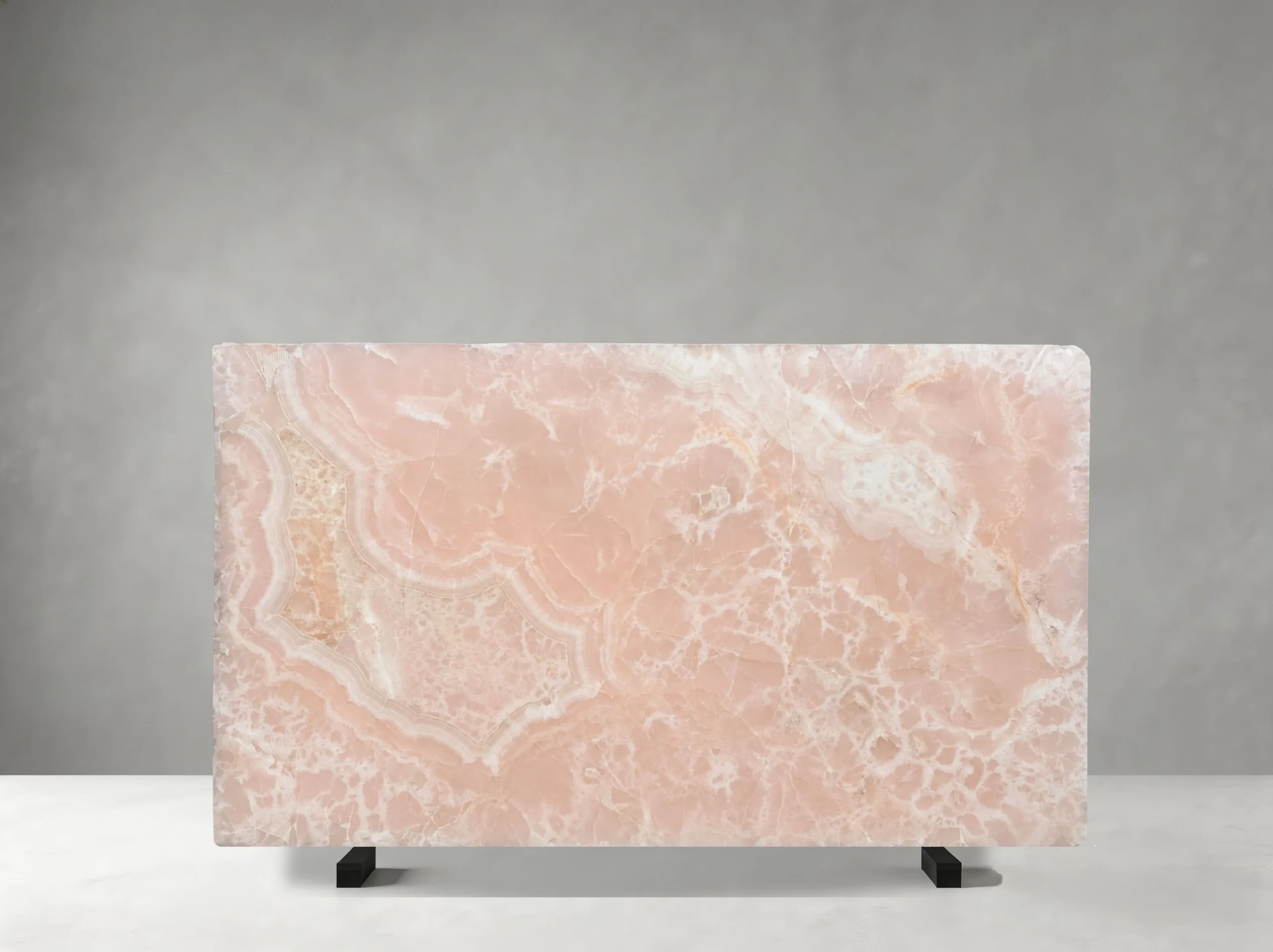 persian-pink-onyx-slab-natural-pattern-detail-05.webp Persian Pink Onyx slab with pale pink colour, flowing ivory bands, and natural crystalline details