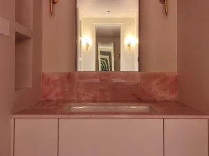 Persian Pink Onyx bathroom vanity top and backsplash with warm pink crystalline patterns