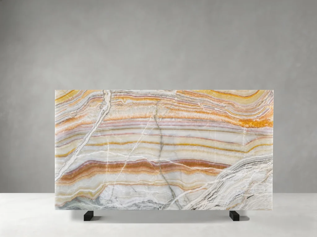 persian rainbow onyx slab with amber gold dusty rose cream ivory and grey layered pattern