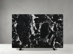 petit antique marble slab with deep black base and bold ivory white breccia veins