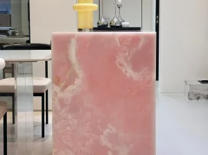 Backlit Pink Onyx island panel with blush-pink colour and white crystalline patterns in a luxury interior