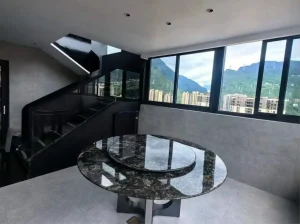 platinum black granite round dining table with matching rotating center section