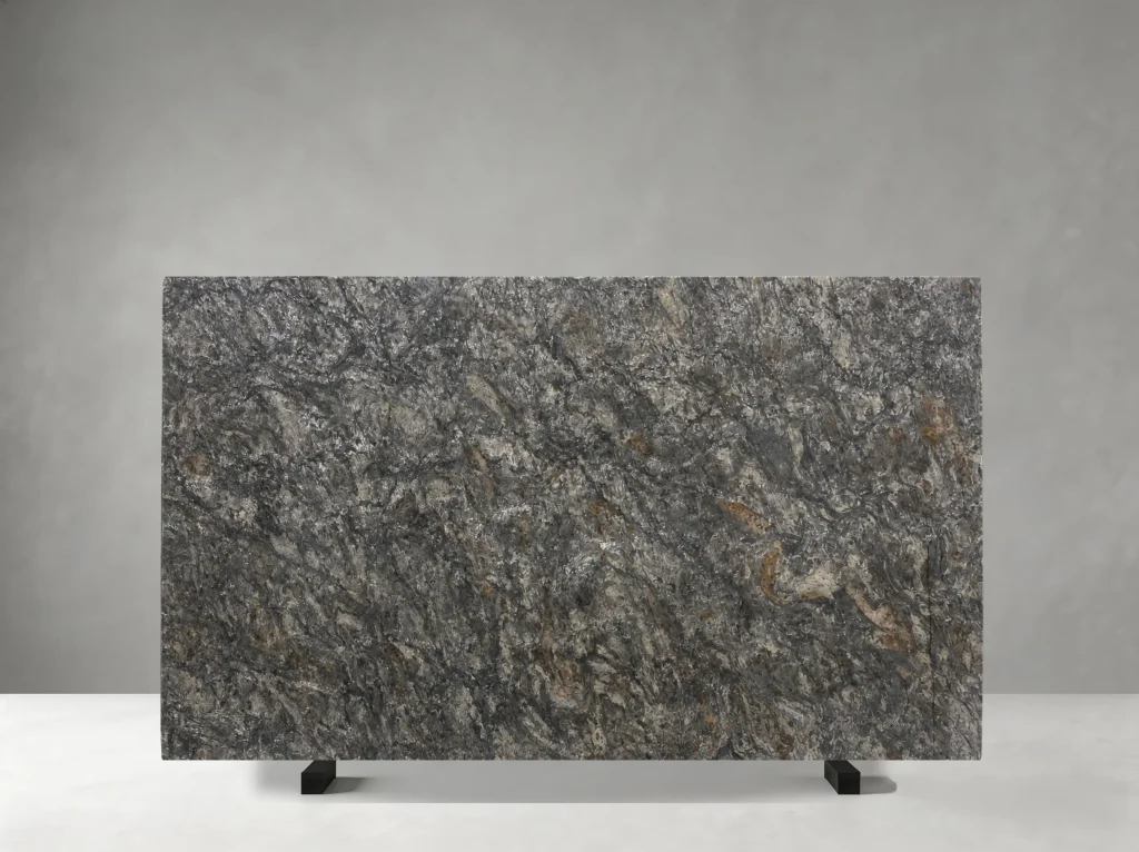 platinum gold granite slab with silver grey crystalline texture and gold brown accents