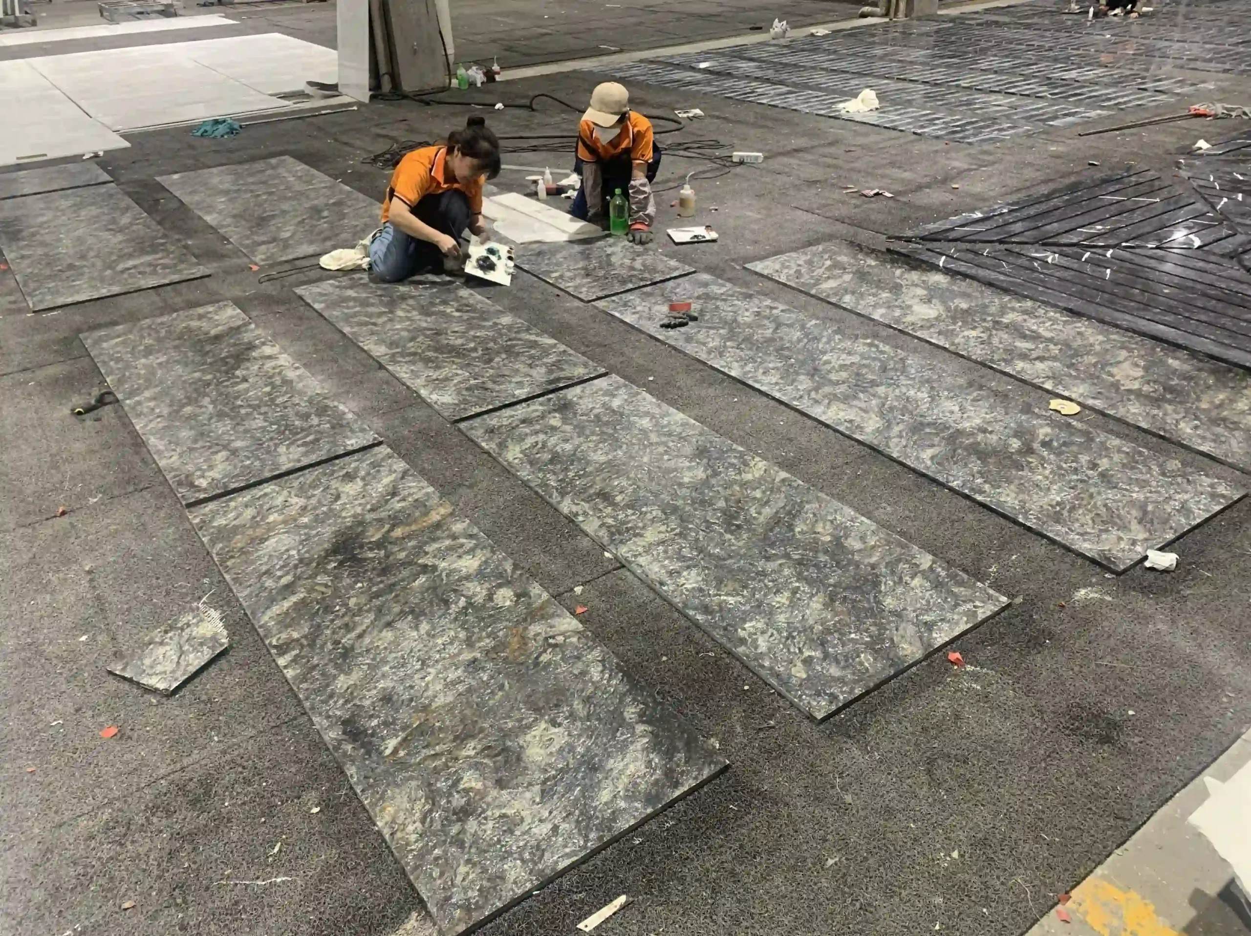 platinum-granite-factory-dry-layout-03.webp platinum granite cut to size pieces arranged for factory dry layout and project checking