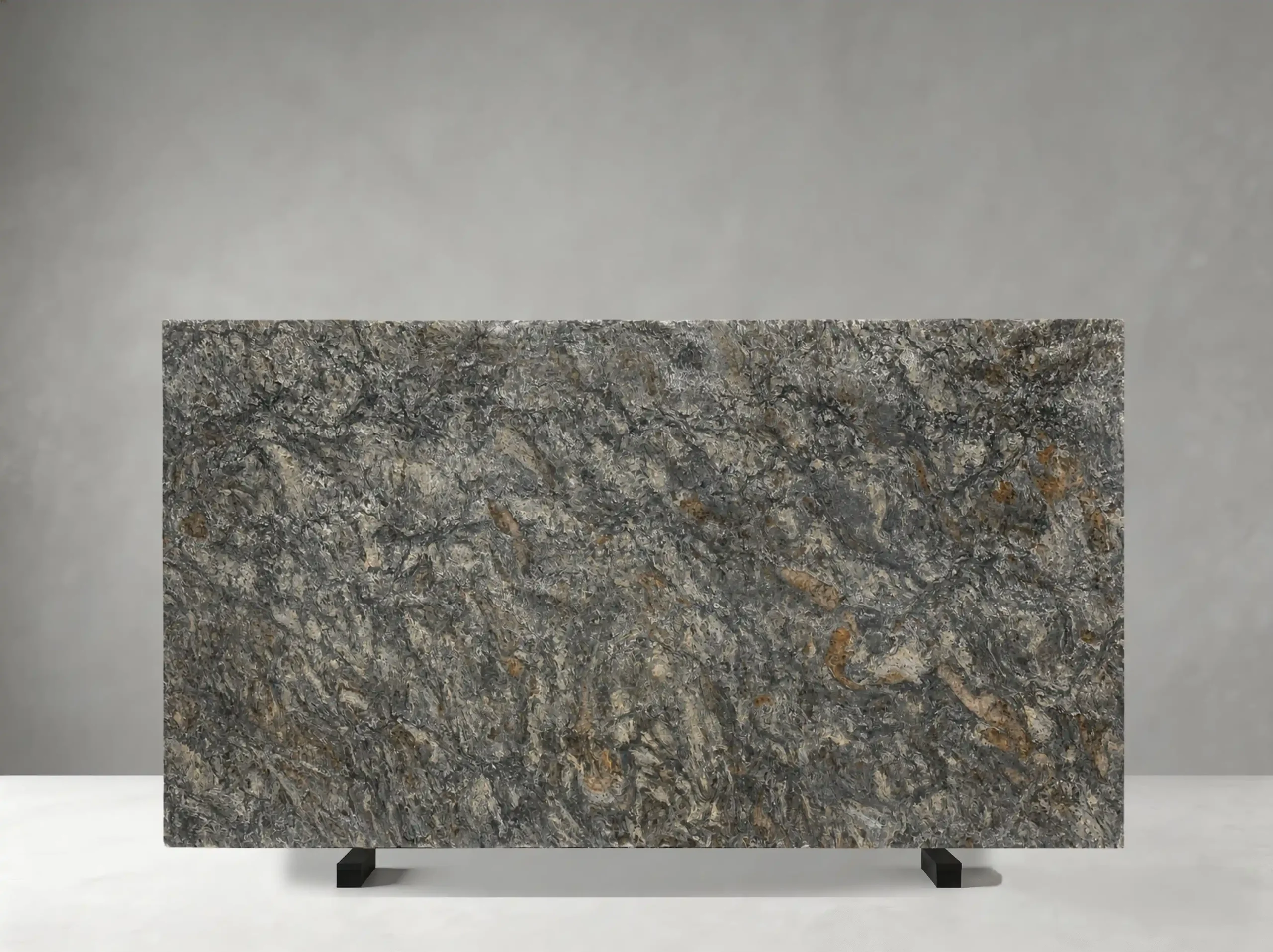 platinum-granite-slab-grey-bronze-movement-04.webp platinum granite slab with grey silver and warm bronze mineral movement