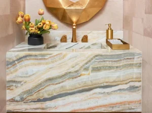 rainbow onyx vanity top and cabinet cladding with cream grey honey and orange bands