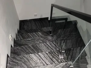 Rosewood Grain Black Marble staircase with polished treads and risers