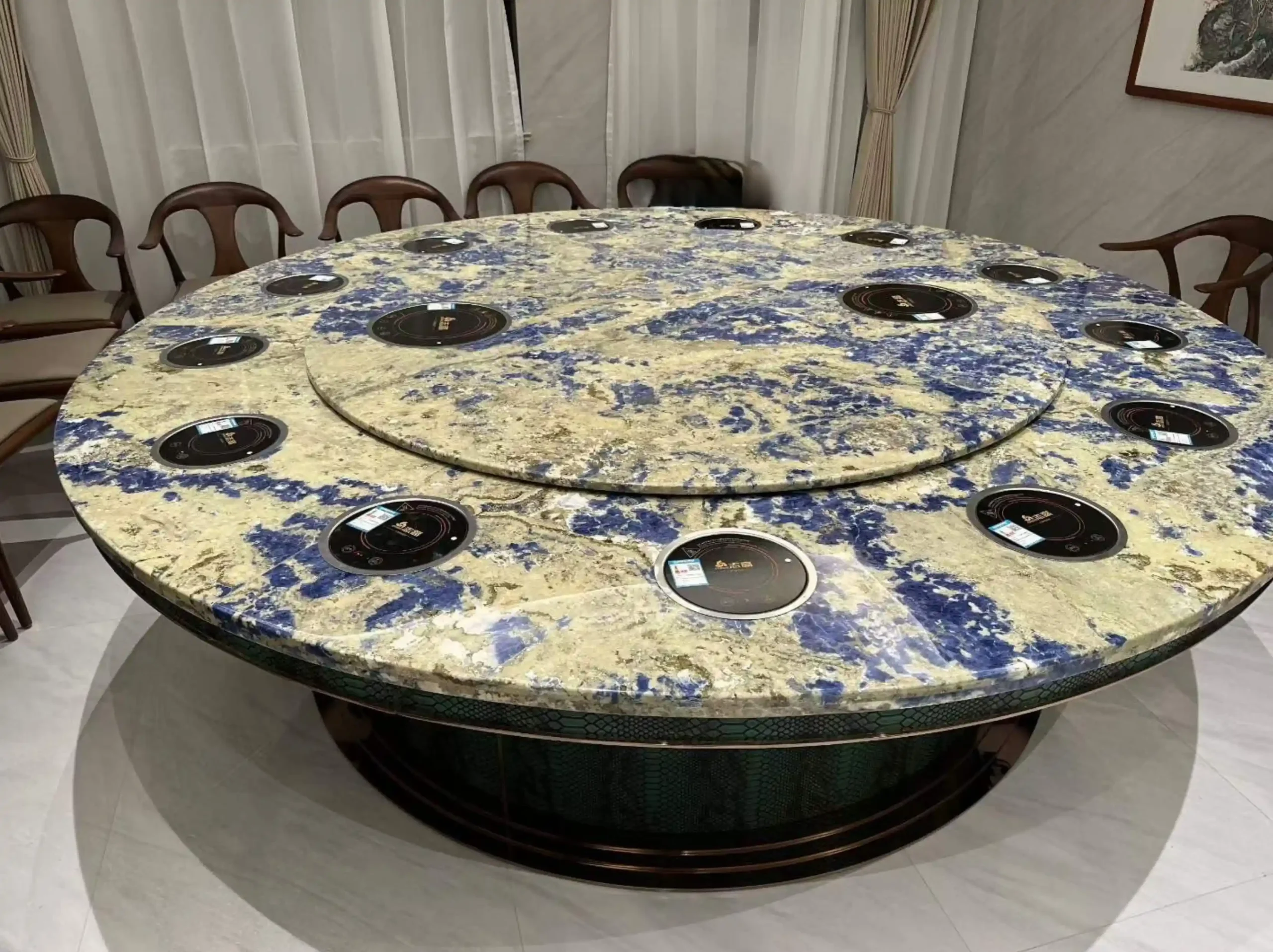 sodalite-royal-blue-marble-round-dining-table-01.webp sodalite royal blue marble round dining table with vivid blue and cream mineral pattern