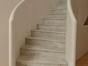 Taj Mahal Quartzite staircase with custom-cut treads and risers