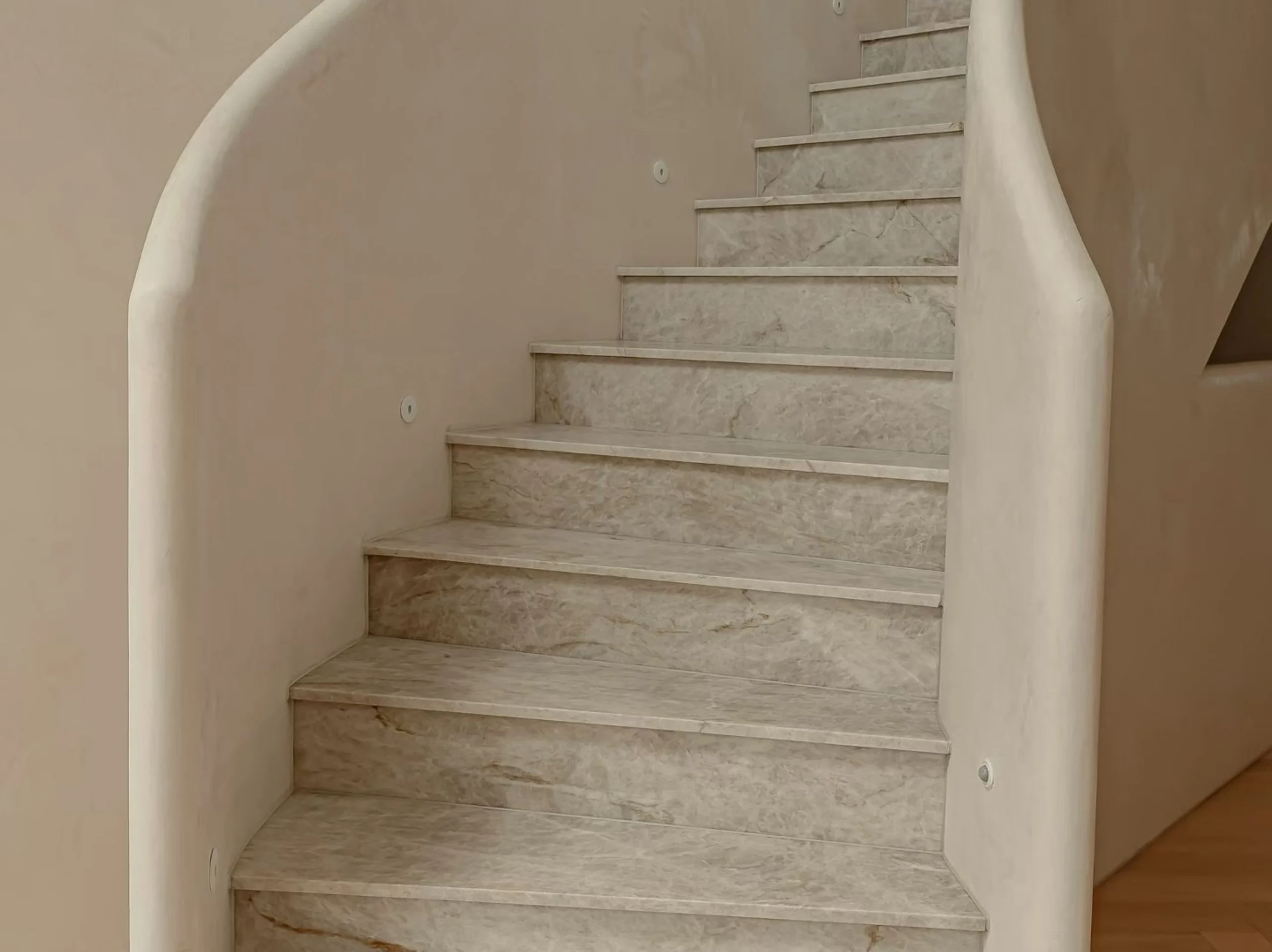 taj-mahal-quartzite-stair-treads.webp Taj Mahal Quartzite staircase with custom-cut treads and risers