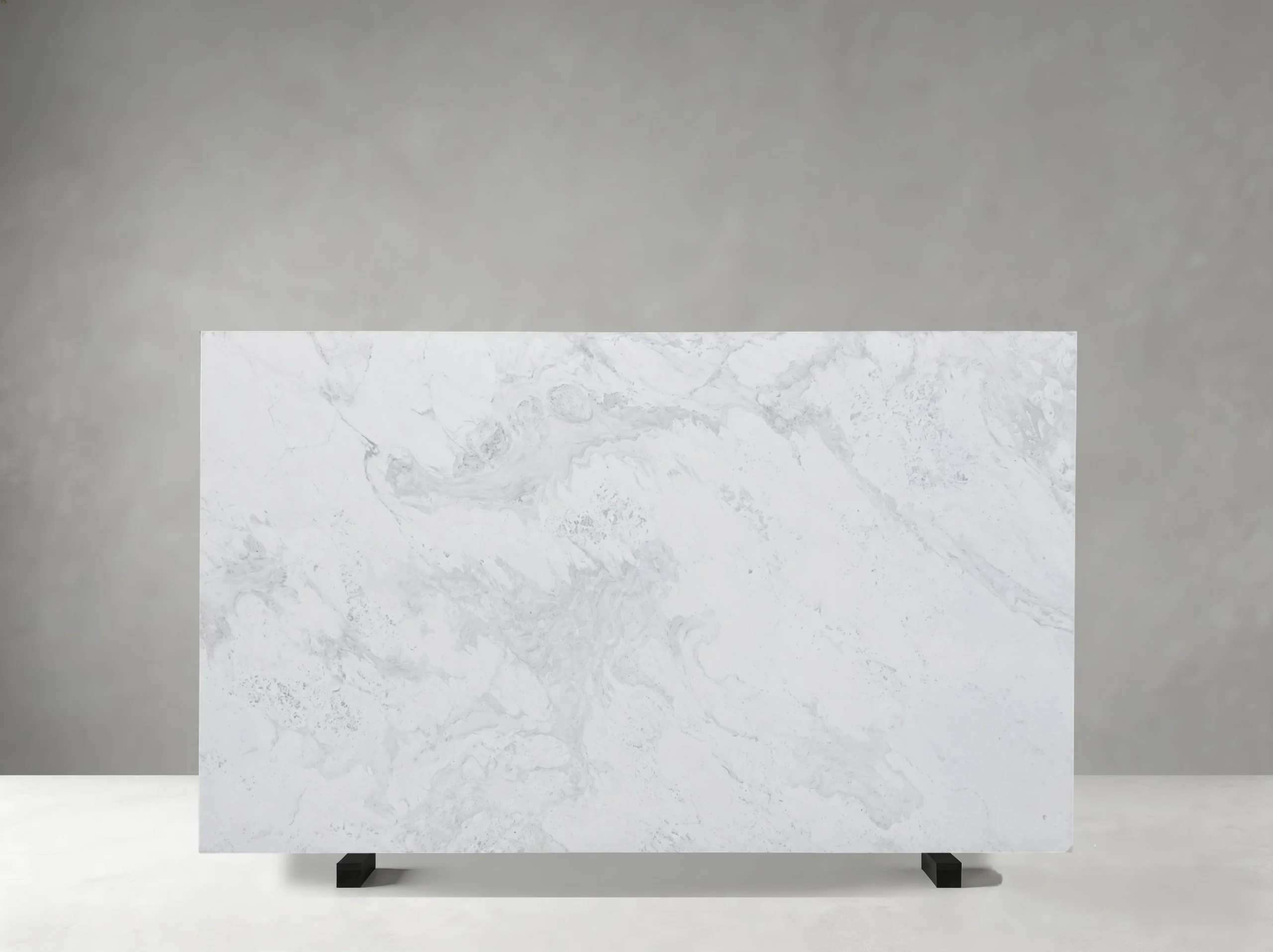 volakas-drama-white-marble-slab-cloudy-grey-pattern.webp Front view of Volakas Drama White Marble slab with soft cloudy and flowing grey veining