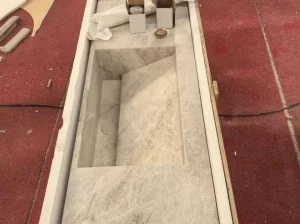 Freestanding White Matira Quartzite custom countertop with ivory and pale grey mineral movement