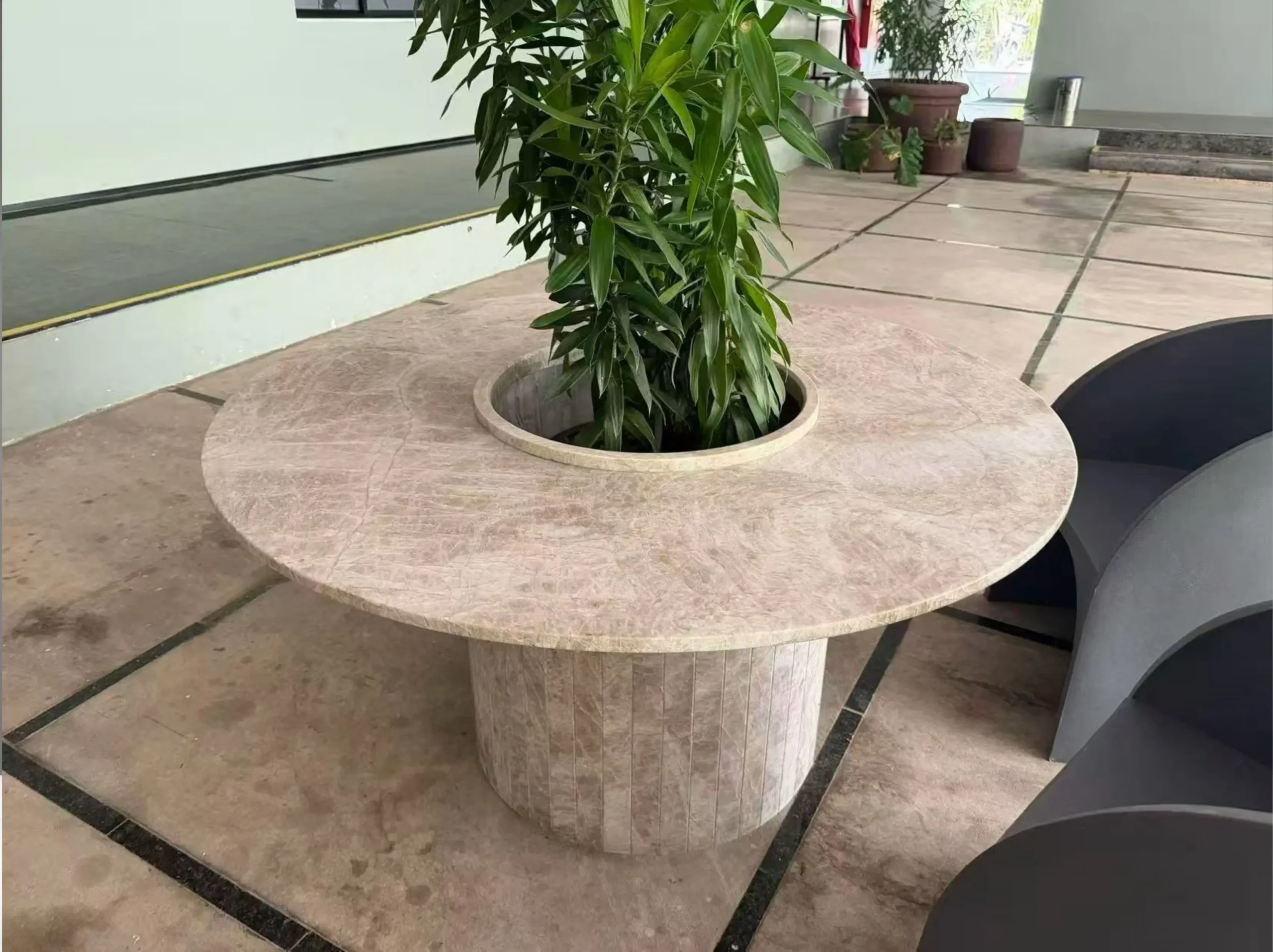 white-matira-quartzite-custom-side-table.webp Custom White Matira Quartzite side table with decorative green plant