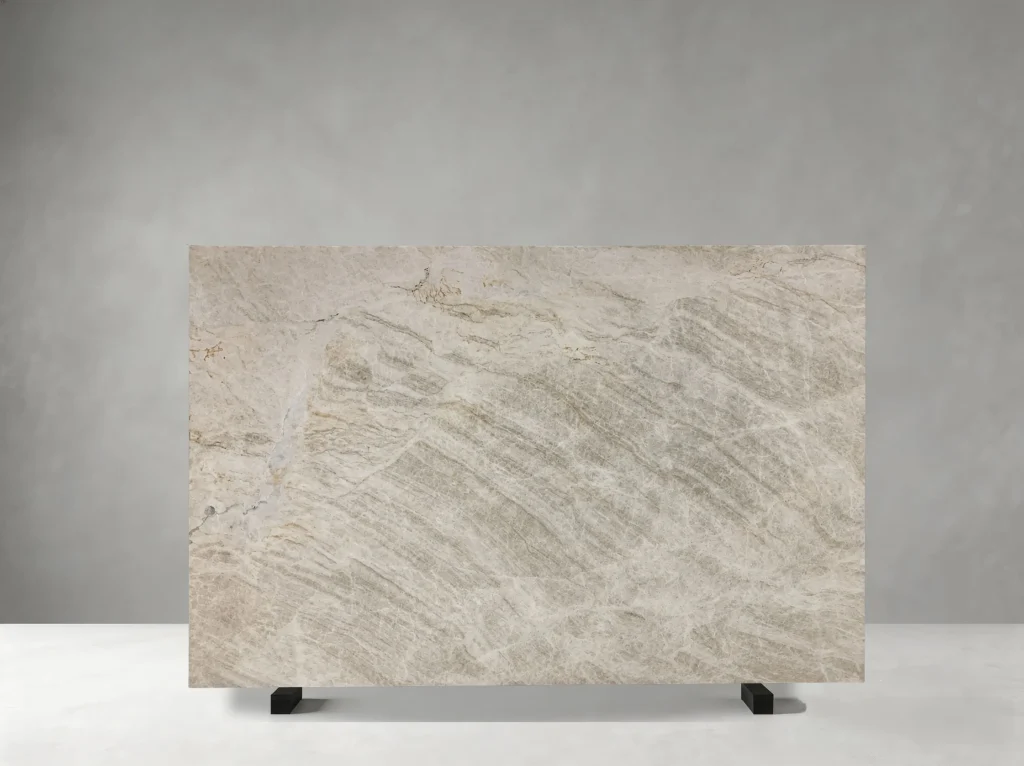 Front view of White Matira Quartzite slab with ivory-white tones and pale grey crystalline veining