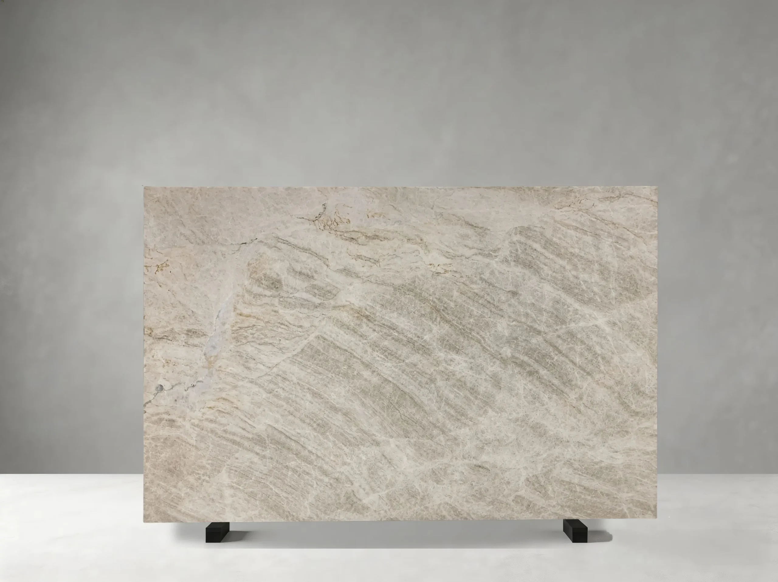 white-matira-quartzite-natural-slab-01.webp Front view of White Matira Quartzite slab with ivory-white tones and pale grey crystalline veining
