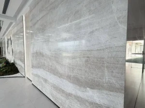 White Perla Venata Quartzite architectural wall cladding with curved custom stone panels