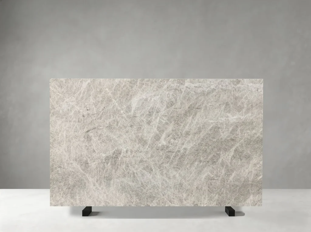 Close-up of White Perla Venata Quartzite crystalline texture and natural silver-grey mineral veins