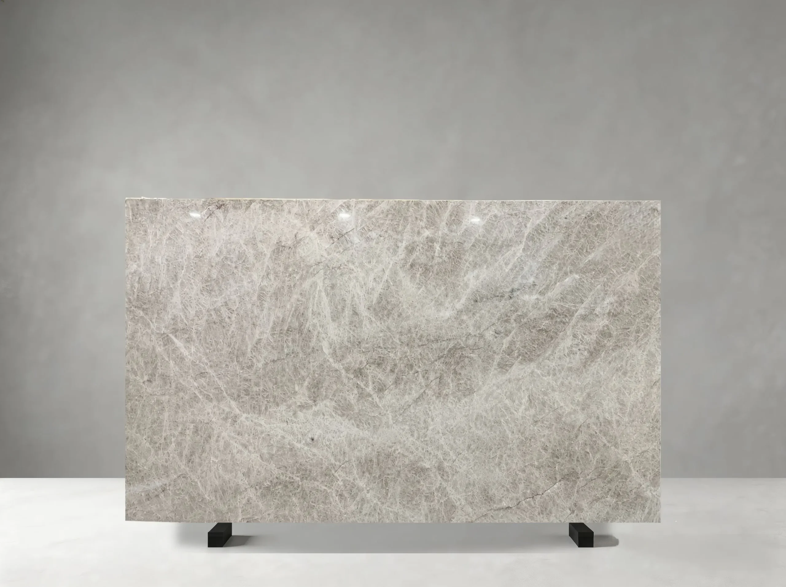 white-perla-venata-quartzite-natural-slab.webp Front view of White Perla Venata Quartzite slab with pearl-white and silver-grey veining