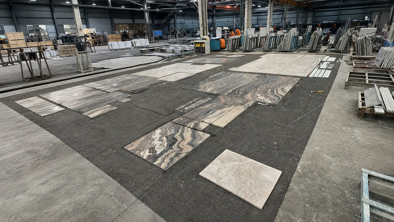 Factory dry lay inspection of marble panels for bookmatched marble walls and vein matching