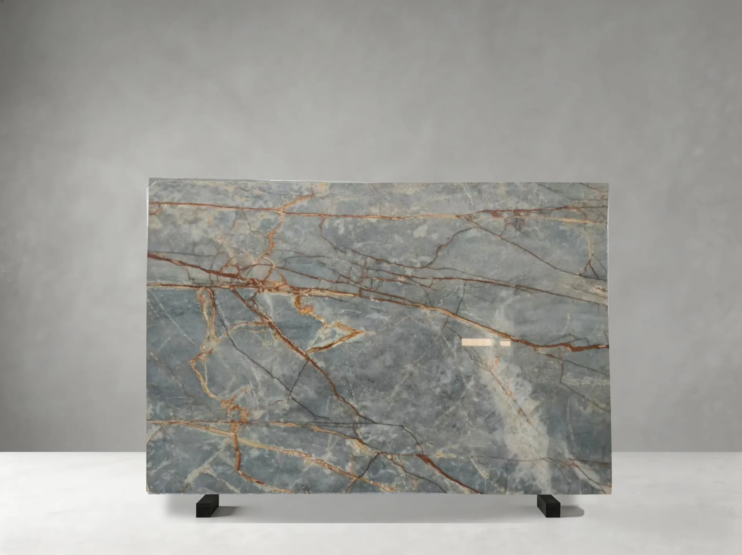 Brown Root Marble full slab showing steel grey, blue-grey and warm brown tones with branching rust-brown and copper veins across broad cloudy mineral fields