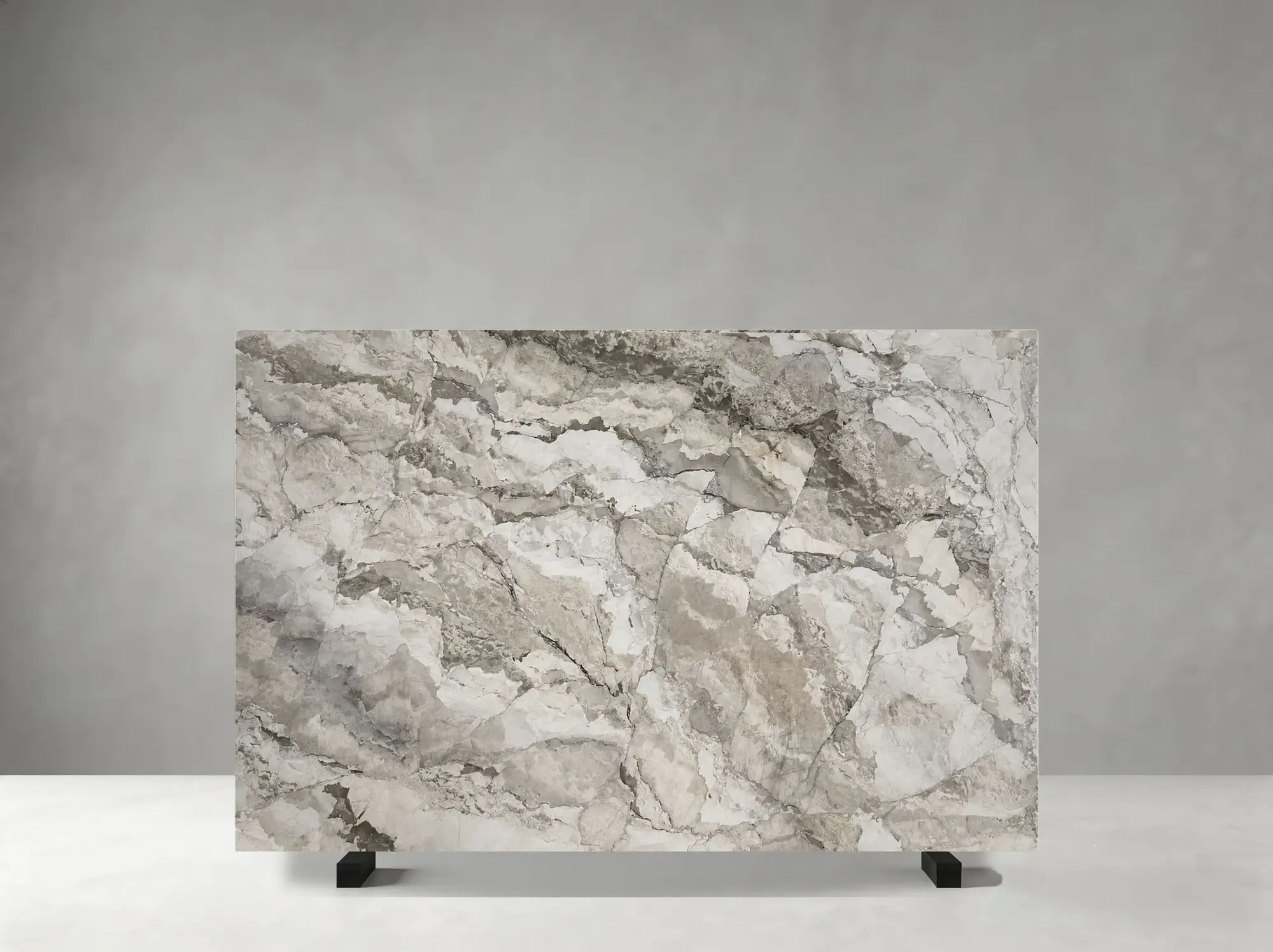 Camus Grey Marble polished slab showing a layered grey field with expressive white and taupe movement