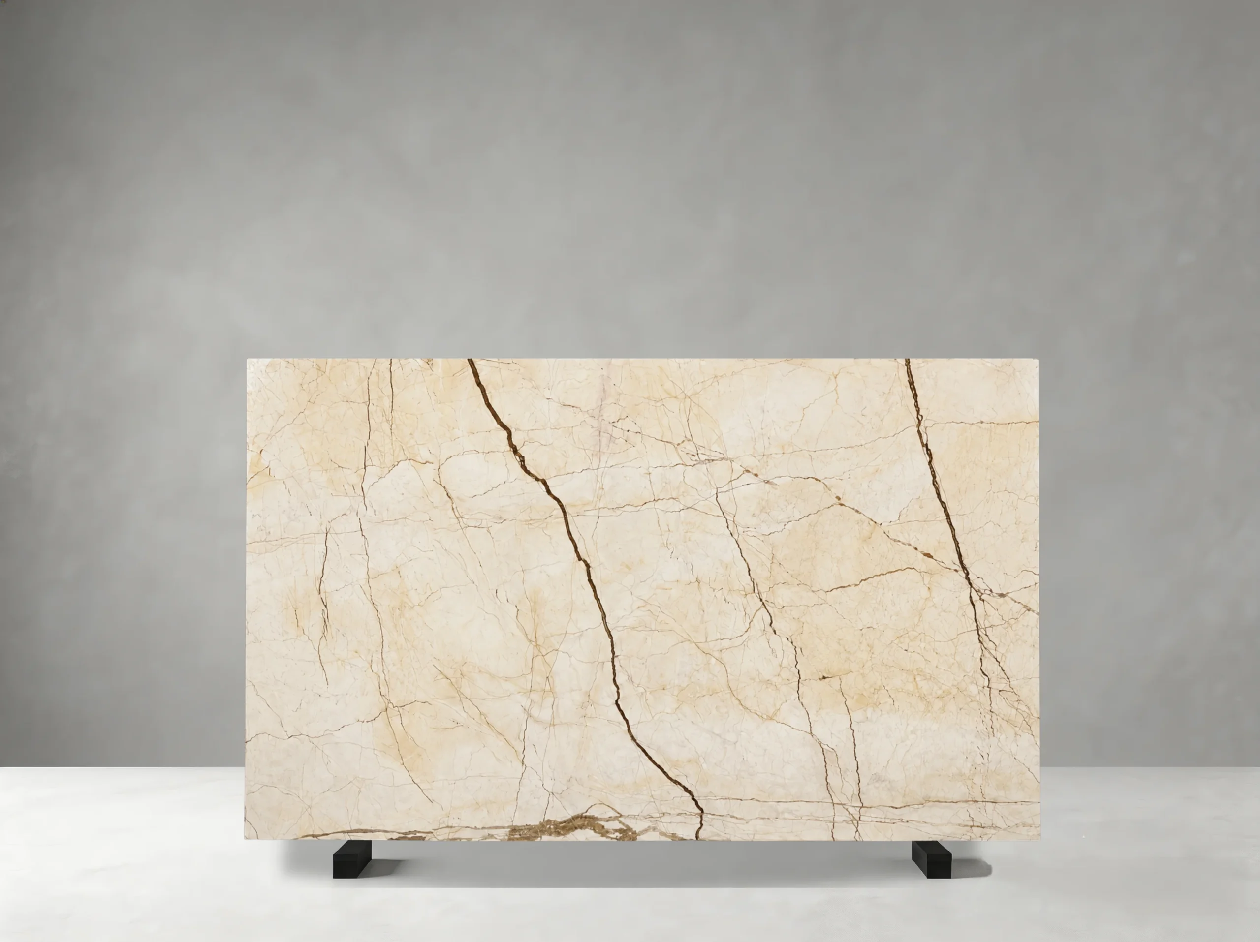 Crema Evita Marble full slab showing light cream and warm beige tones with delicate fossil-like details and soft tonal clouds