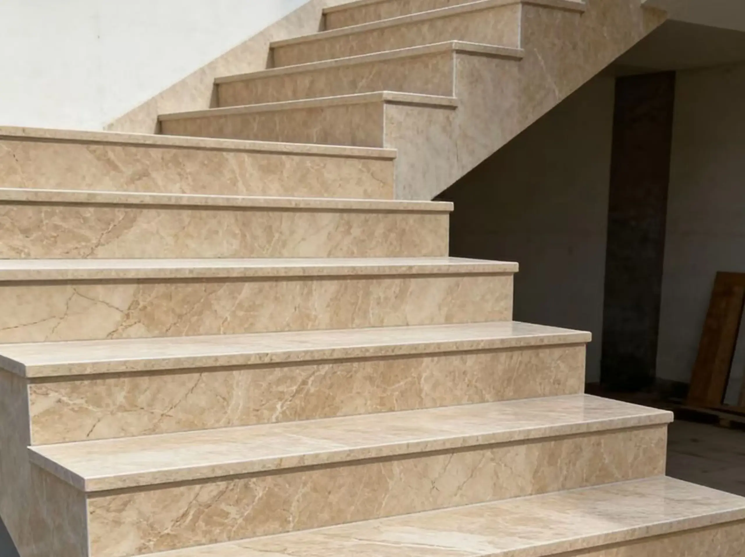 Daino Reale Marble staircase with coordinated beige stone treads risers and edge profiles