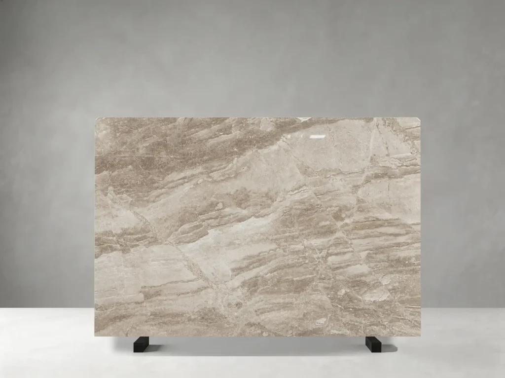 Daino Royal Marble polished slab with soft beige field and broad ivory cloudy movement