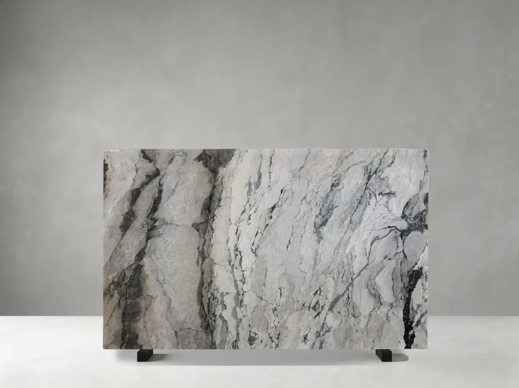 Fantasy Wave Marble polished slab showing a bright white-grey surface crossed by dramatic charcoal waves