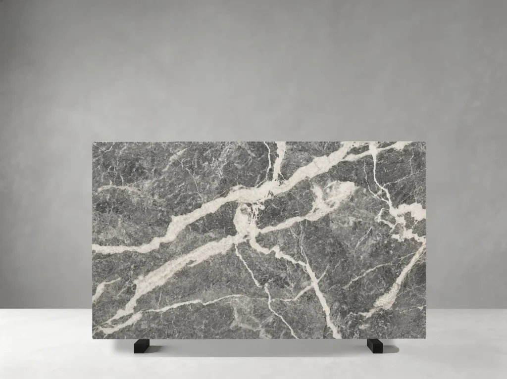 Fior Di Pesco Grigio Marble full slab showing medium grey, charcoal, white and soft taupe tones with dramatic white mineral ribbons and fractured diagonal veining