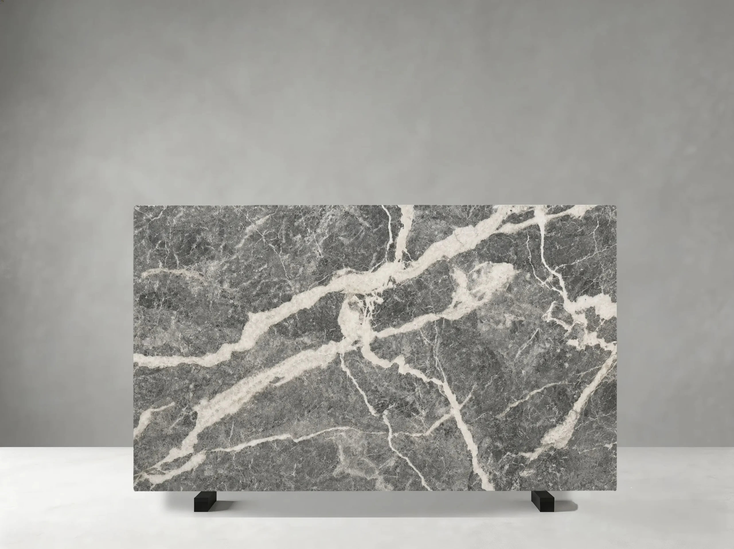 Fior Di Pesco Grigio Marble full slab showing medium grey, charcoal, white and soft taupe tones with dramatic white mineral ribbons and fractured diagonal veining