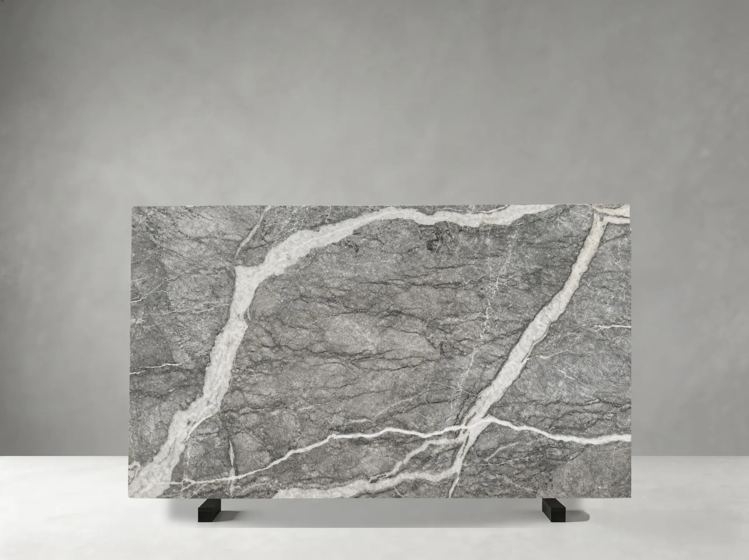 Fior Di Pesco Grigio Marble full slab showing medium grey, charcoal, white and soft taupe tones with dramatic white mineral ribbons and fractured diagonal veining
