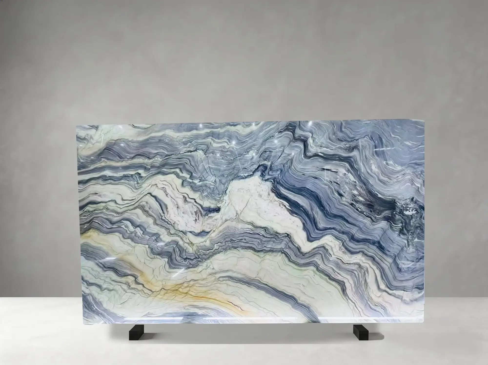 Fusion Blue Quartzite polished slab detail showing layered wave bands with bold flowing mineral movement