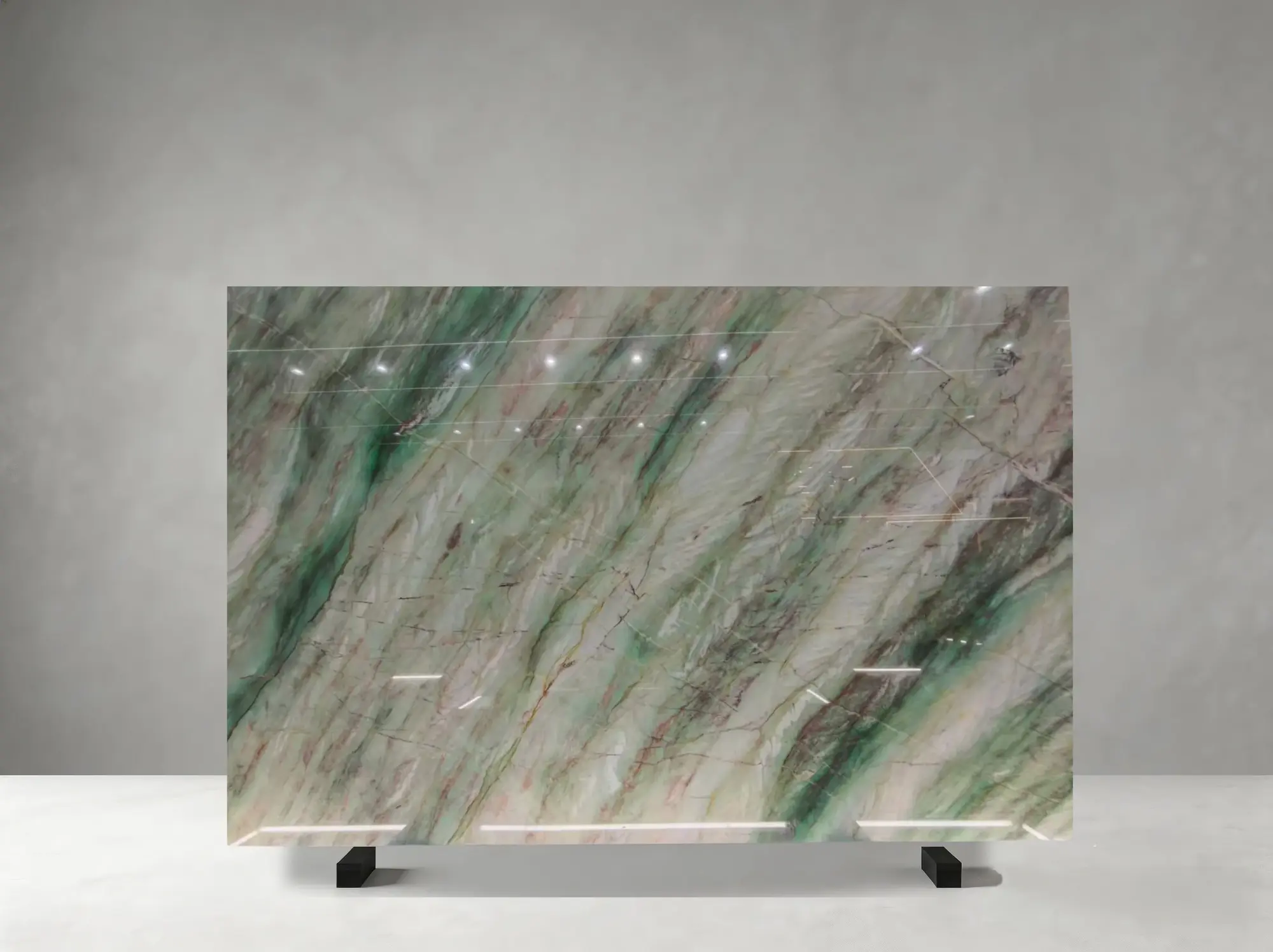 Gaya Dream Quartzite polished slab showing a vivid emerald-white field with elegant layered movement