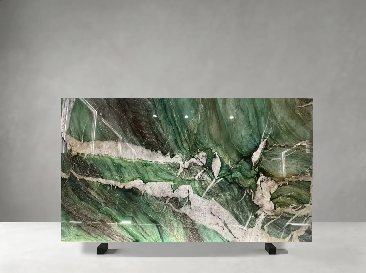Green Star Quartzite full slab showing emerald green, forest green, white and silver-grey tones with bold crystalline bands, sweeping white ribbons and layered green mineral movement