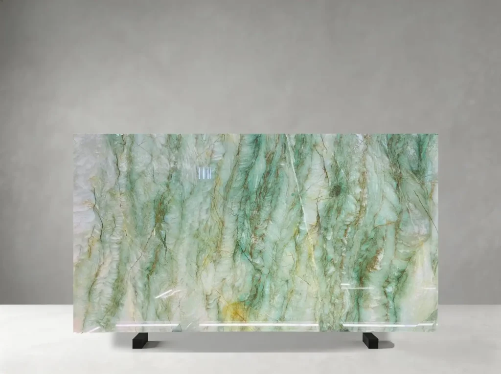 Jade Quartzite polished slab showing a fresh jade-white surface with graceful diagonal veins and golden accents