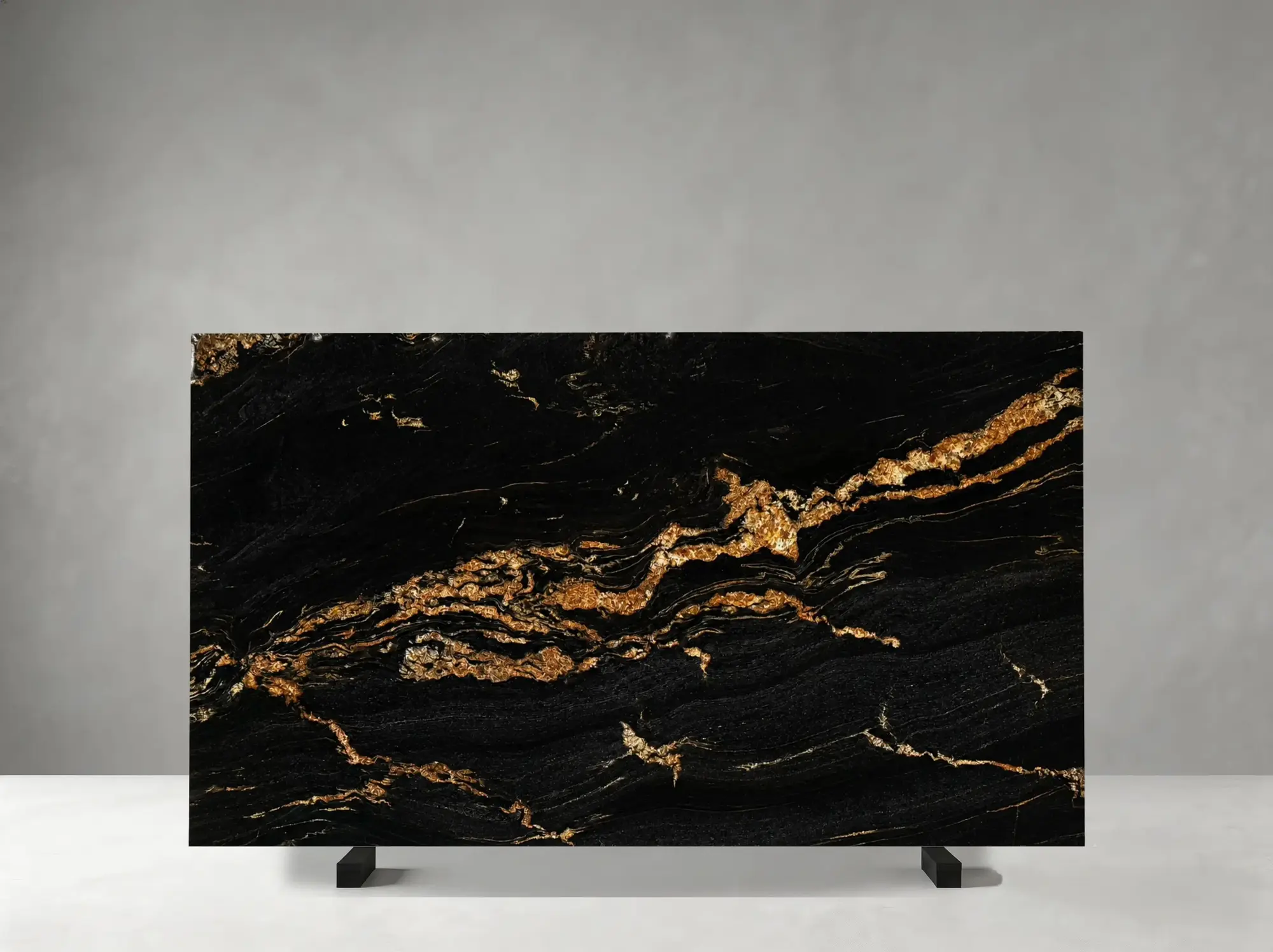 Magma Gold Granite polished slab detail showing dramatic golden wave bands with rich high-contrast movement