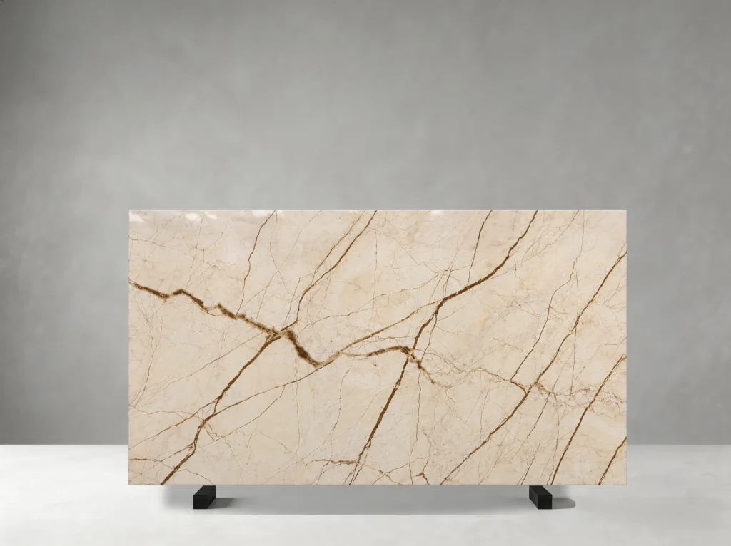 Menes Gold Marble slab with creamy beige and muted gold tones with sweeping brown-gold veining