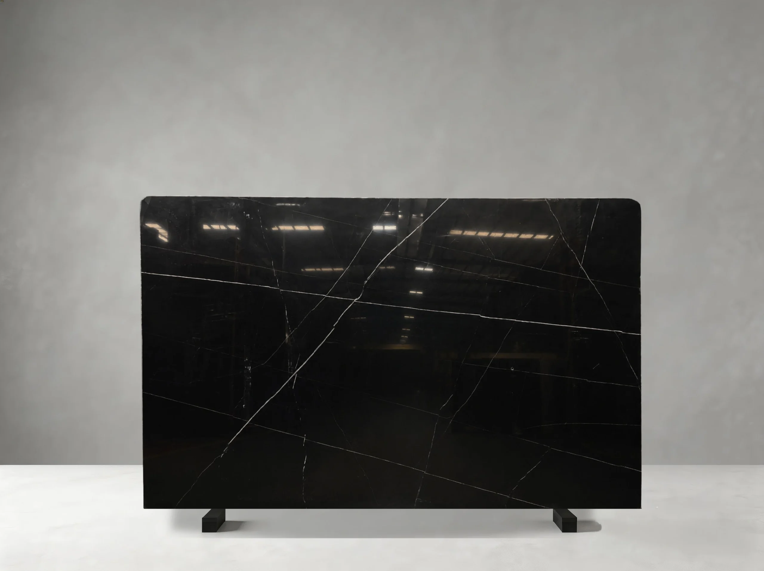 Nero Marquina Marble full slab showing jet black, charcoal and crisp white tones with thin irregular white veins with occasional stronger diagonal lines